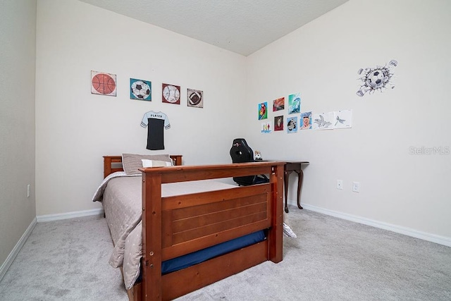 bedroom featuring light colored carpet