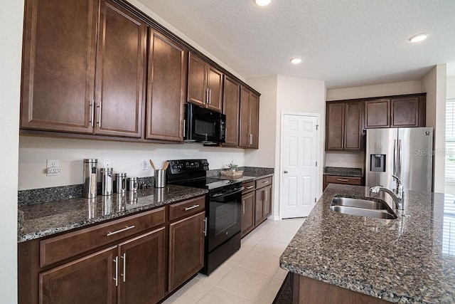 kitchen with a textured ceiling, sink, dark brown cabinetry, and black appliances