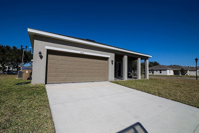 ranch-style house with a garage and a front yard