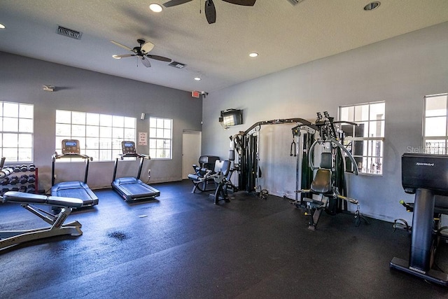 exercise room featuring a textured ceiling and ceiling fan