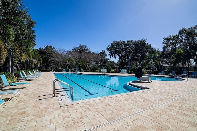 view of swimming pool featuring a patio