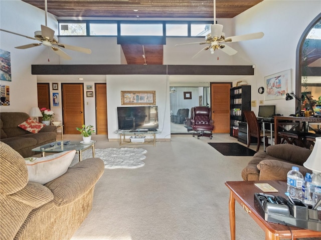 carpeted living room with a healthy amount of sunlight, ceiling fan, and high vaulted ceiling