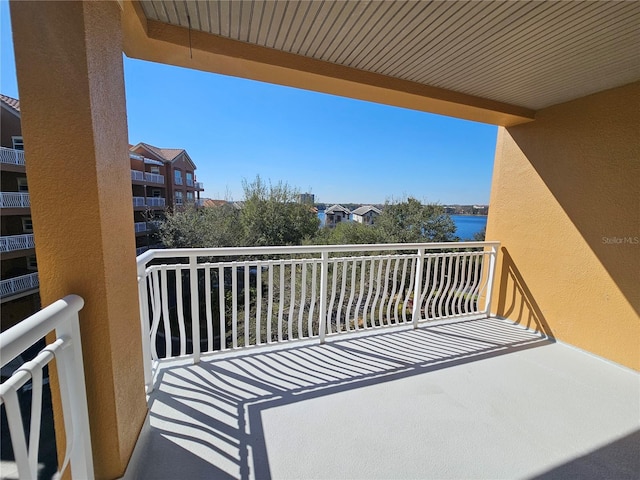 balcony featuring a water view