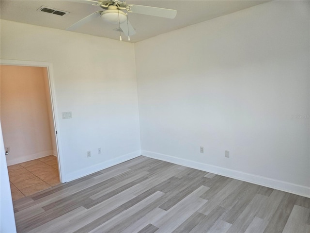 unfurnished room with ceiling fan and light hardwood / wood-style flooring