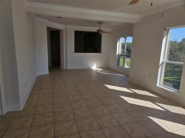 tiled spare room featuring ornamental molding and ceiling fan