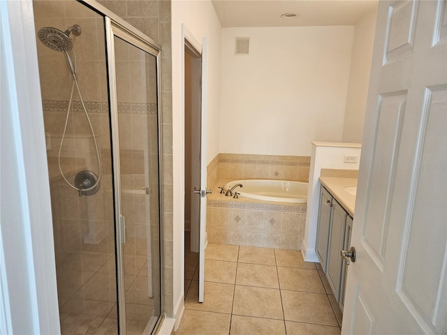 bathroom featuring vanity, shower with separate bathtub, and tile floors