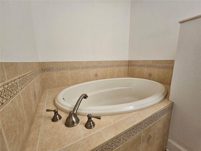 bathroom featuring tiled bath