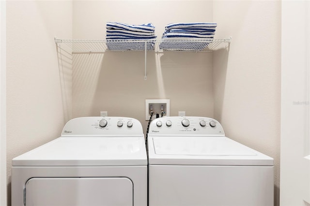 washroom featuring washer hookup and washing machine and dryer