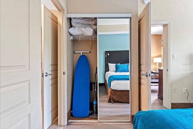 bedroom featuring hardwood / wood-style flooring and a closet