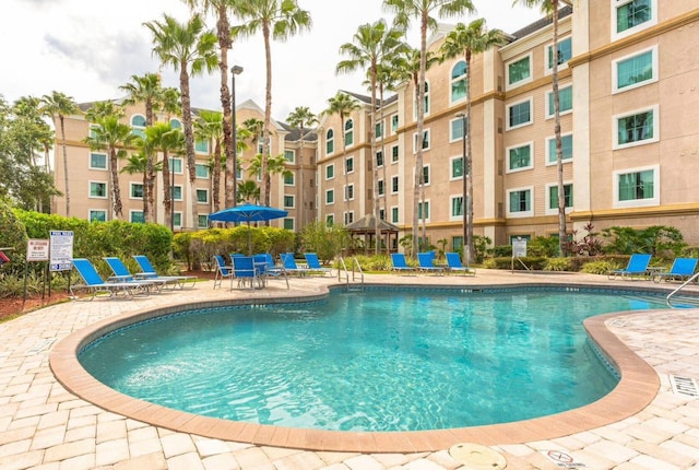 view of swimming pool featuring a gazebo and a patio