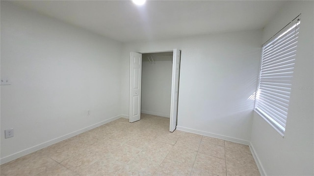 unfurnished bedroom with a closet