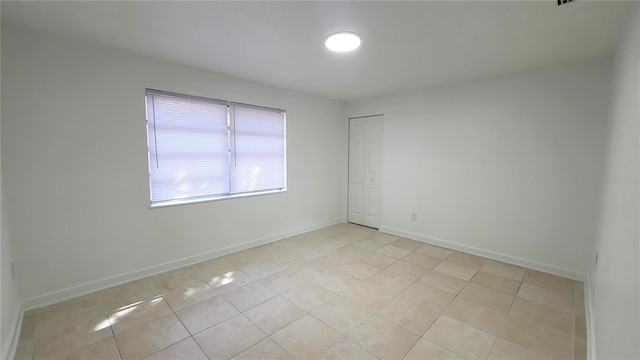 empty room with light tile patterned floors