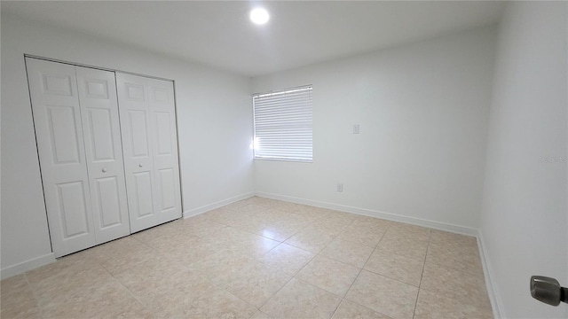 unfurnished bedroom featuring a closet