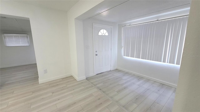 entryway with light hardwood / wood-style floors