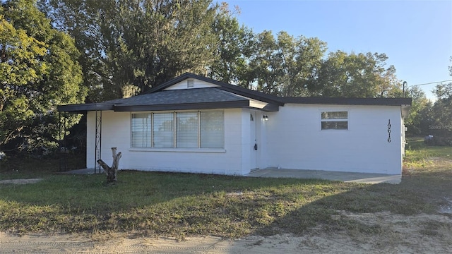 exterior space featuring a front lawn