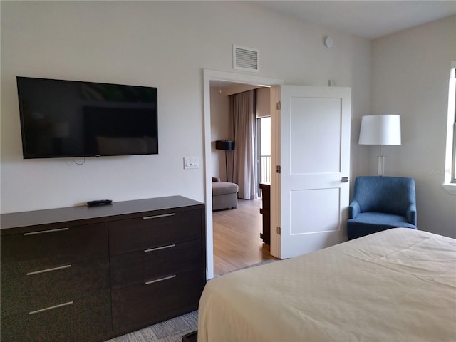 bedroom with light wood-type flooring