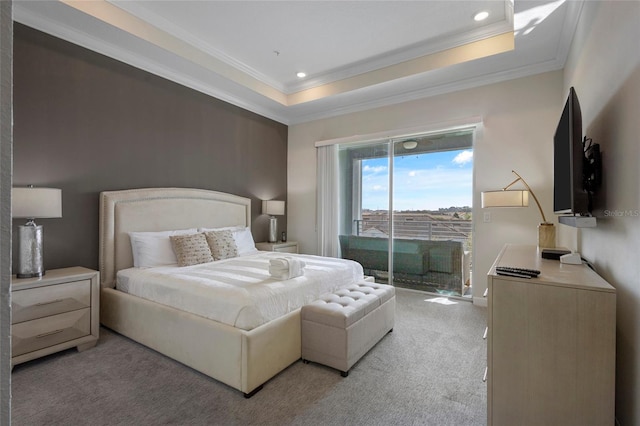 carpeted bedroom with access to exterior, a raised ceiling, and crown molding