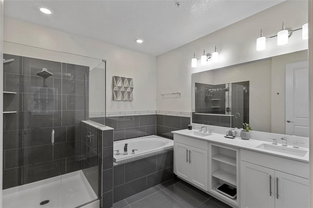 bathroom with separate shower and tub, dual sinks, vanity with extensive cabinet space, and tile flooring