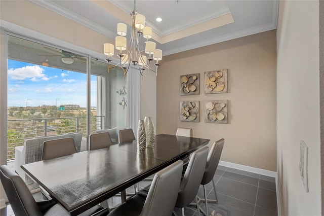 tiled dining space featuring a chandelier, crown molding, and a raised ceiling