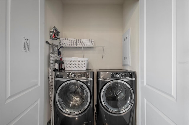 washroom featuring washer and dryer