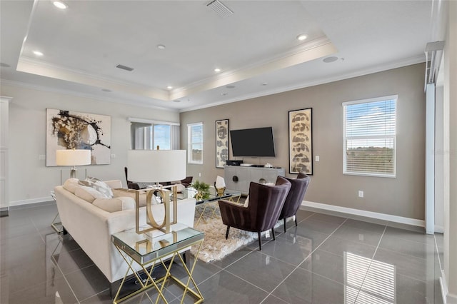 tiled living room featuring plenty of natural light, crown molding, and a raised ceiling