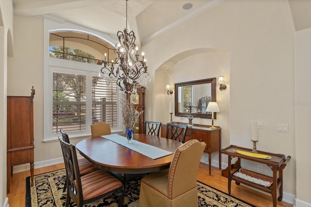 dining room with an inviting chandelier and light wood-type flooring