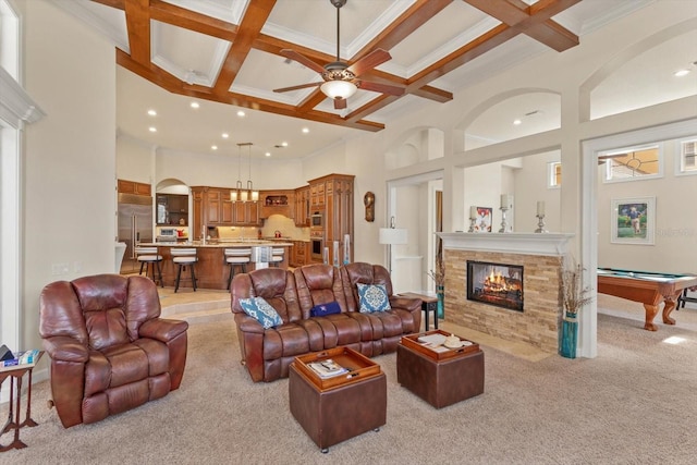 carpeted living room featuring pool table, a towering ceiling, coffered ceiling, and beamed ceiling