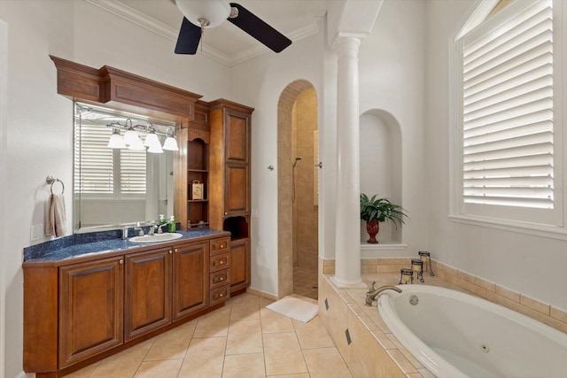 bathroom featuring decorative columns, tile patterned floors, crown molding, and shower with separate bathtub