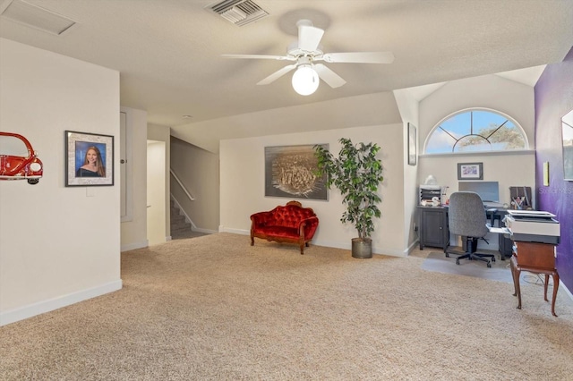 home office with carpet floors, vaulted ceiling, and ceiling fan