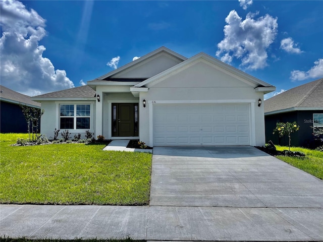 ranch-style home featuring a front lawn and a garage