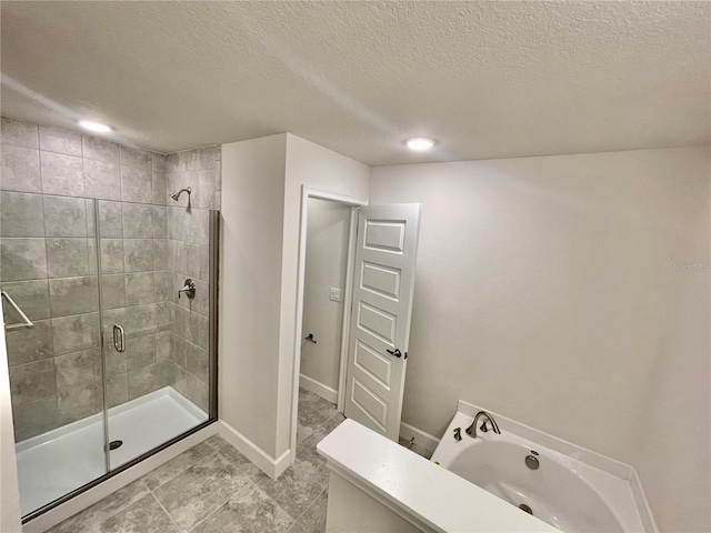 bathroom featuring a shower with door, a textured ceiling, and tile floors