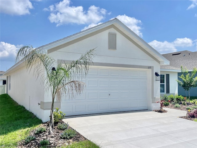 view of side of property featuring a garage