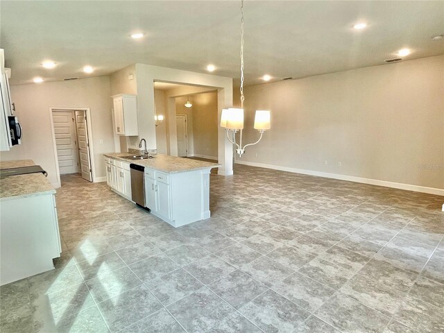 kitchen featuring sink, light tile floors, hanging light fixtures, appliances with stainless steel finishes, and white cabinets