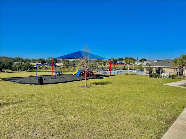 view of playground featuring a lawn