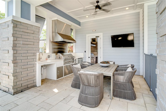 view of patio with exterior kitchen, ceiling fan, sink, and area for grilling