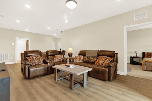 living room with light hardwood / wood-style floors