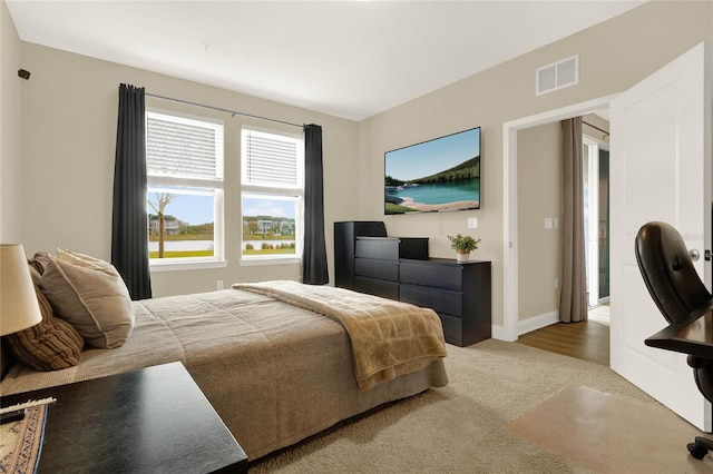 bedroom with hardwood / wood-style floors