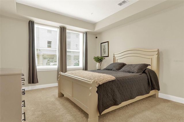 bedroom featuring light colored carpet