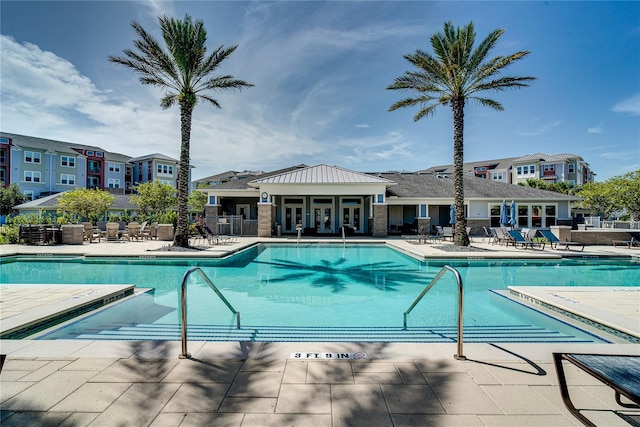 view of swimming pool featuring a patio