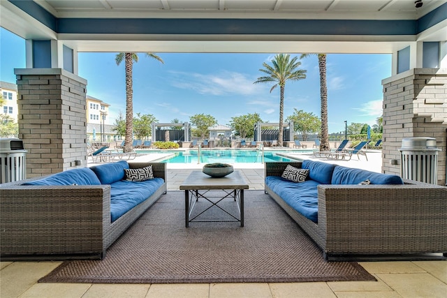 view of patio / terrace with an outdoor living space and a community pool