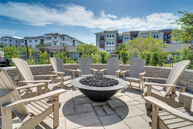 view of patio / terrace featuring an outdoor fire pit