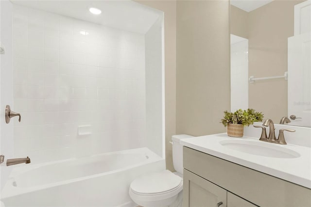 full bathroom with vanity, toilet, and tiled shower / bath combo