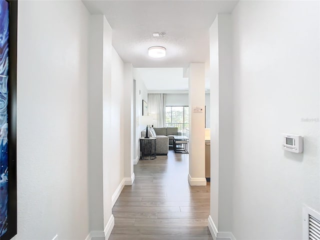 hallway featuring hardwood / wood-style floors