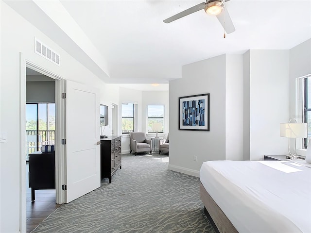 carpeted bedroom featuring access to outside and ceiling fan