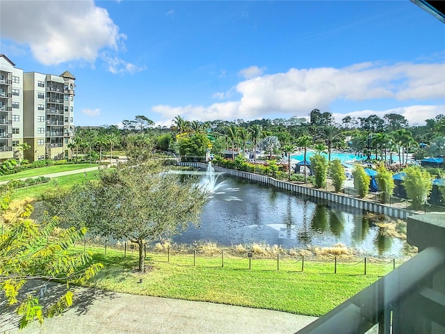 surrounding community featuring a lawn and a water view