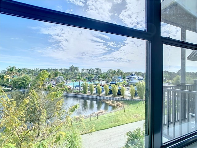 doorway to outside with a water view