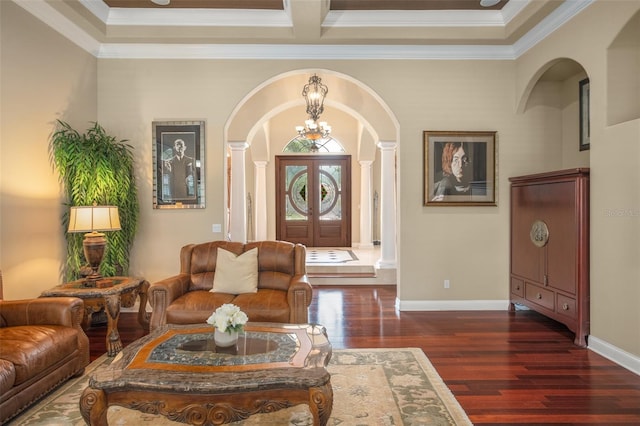 6443 Cartmel Ln, Windermere, FL 34786 - foyer entrance with arched walkways, dark wood finished floors, an inviting chandelier, ornamental molding, and baseboards
