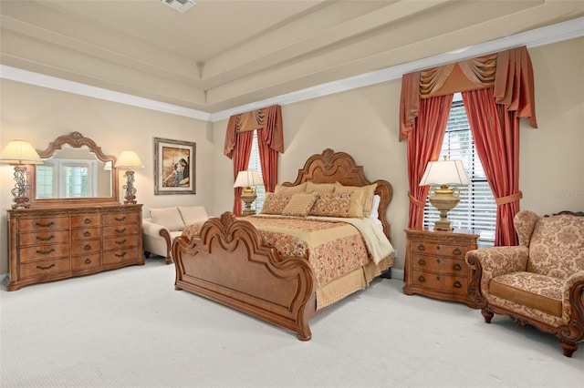 bedroom featuring carpet floors, visible vents, a raised ceiling, and crown molding