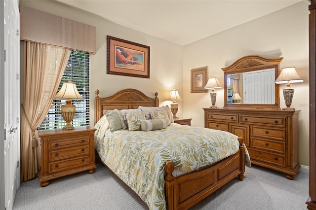 bedroom featuring light carpet