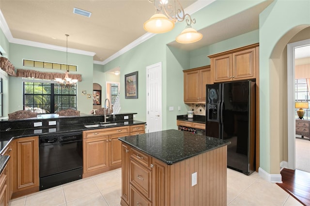 kitchen with sink, light tile patterned flooring, black appliances, and a center island